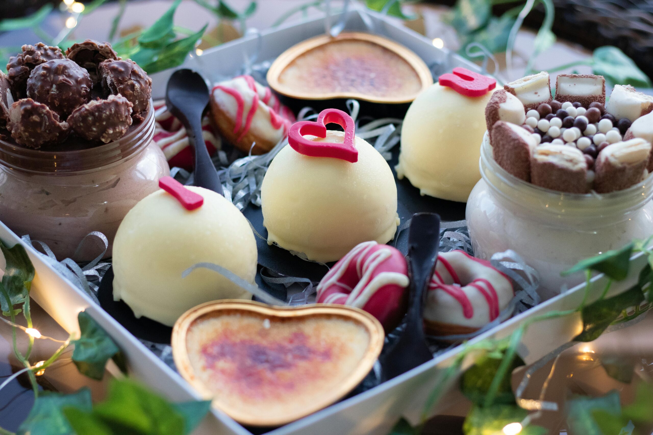 A beautifully arranged dessert platter featuring assorted sweets perfect for a romantic Valentine's celebration.